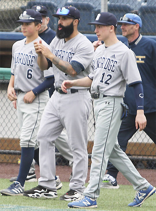 File photos
Geoff Brown celebrates with his team after a playoff victory in Everett.