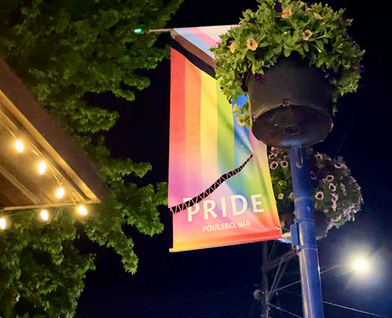 Pam Keeley courtesy photo
A Pride banner in downtown Poulsbo that was cut by a knife has since been stitched back together by a community member.