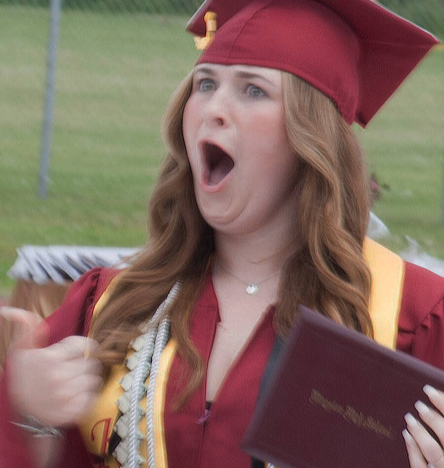 Tyler Shuey/Kitsap News Group photos
A Kingston High School graduate is elated after receiving her diploma.