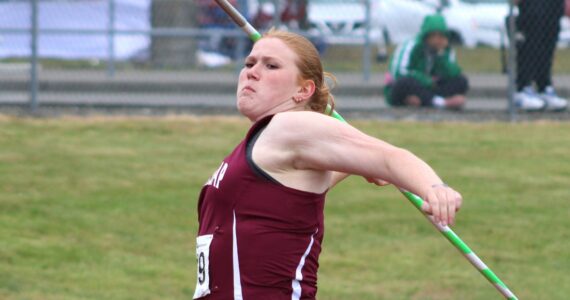 Elisha Meyer/Kitsap News Group
Grace Degarimore muscles up for her state-winning javelin throw in the finals.