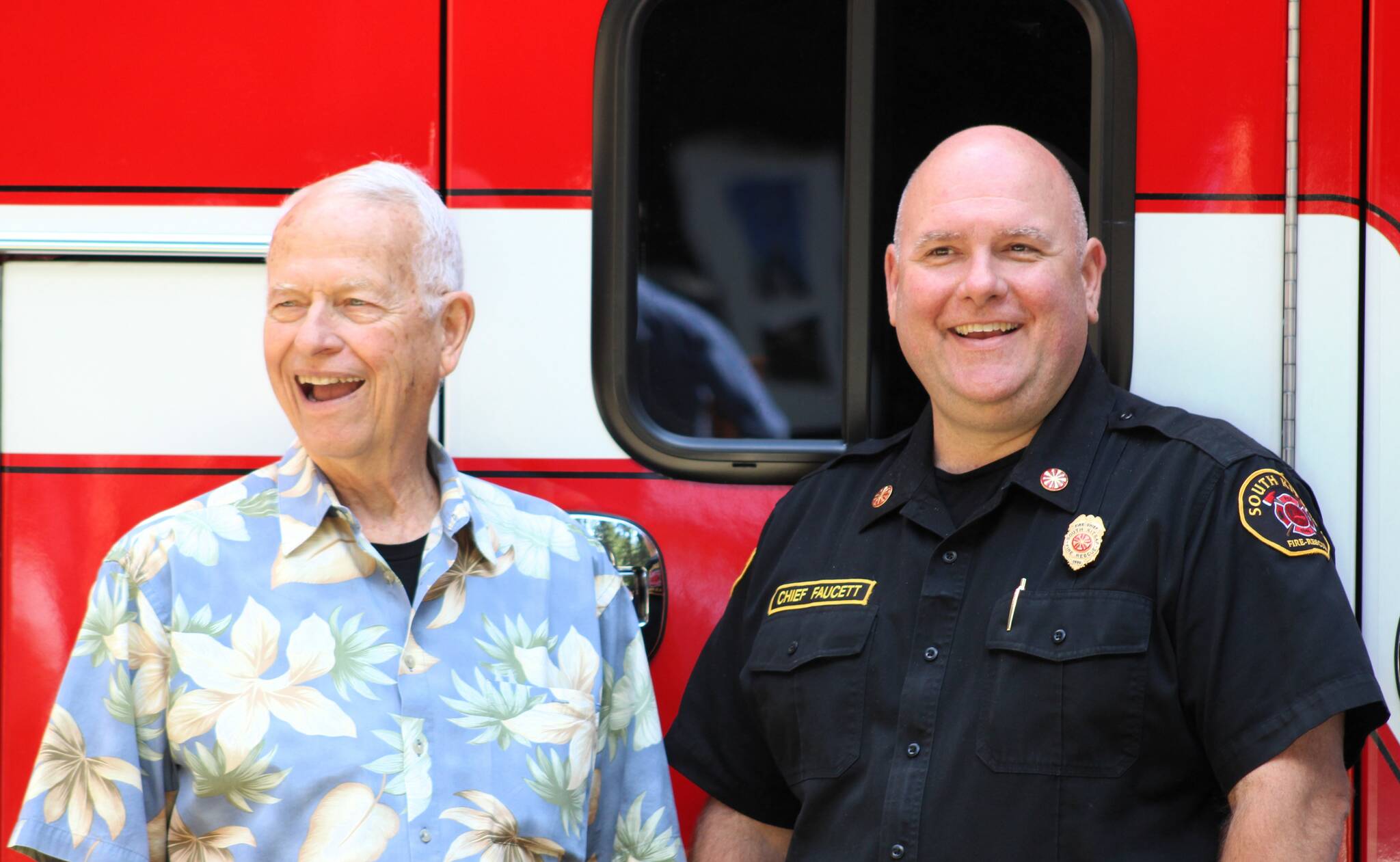 Elisha Meyer/Kitsap News Group photos
Robert Roblee, left, stands beside SKF&R fire chief Jeff Faucett in front of the donated ambulance honoring himself and his late life partner Ron Johnson.