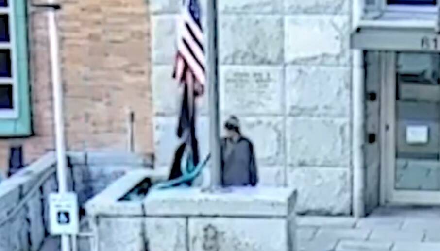 KCSO courtesy photo
Footage from security cameras around the Kitsap County Superior Court in Port Orchard shows an alleged suspect stealing the American flag from the outside flag pole.