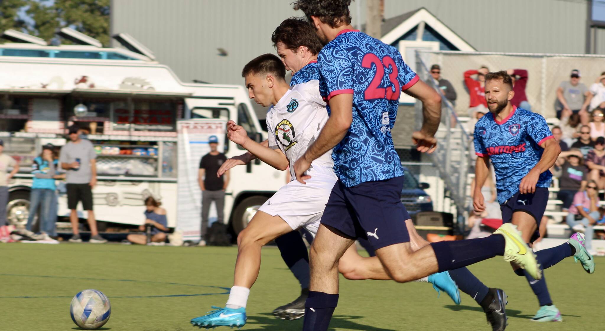 Elisha Meyer/Kitsap News Group photos
POFC’s Michael Divano fights to make his way downfield in the first half of the CPL1 title match.