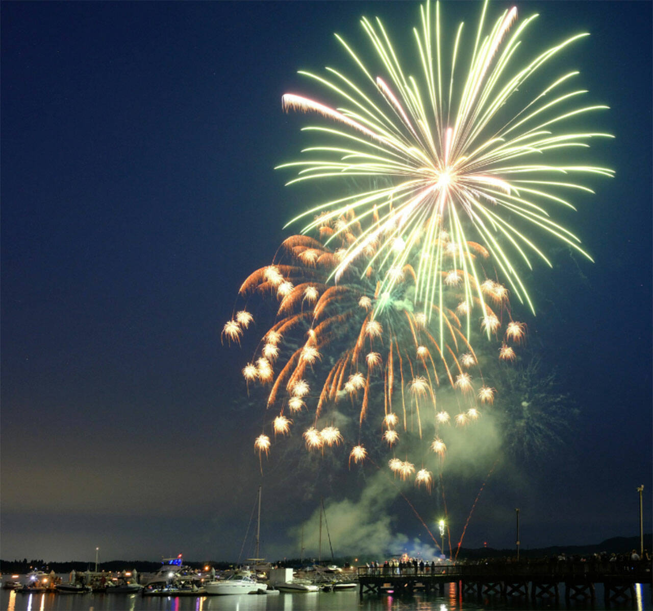 Damon Williams/Kitsap News Group photos
Boaters and people on the dock enjoy the Whaling Days fireworks show on the Silverdale waterfront July 26.