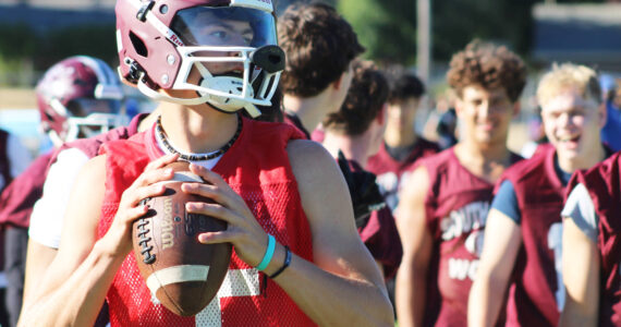 Elisha Meyer/Kitsap News Group photos
South Kitsap junior quarterback Franklin Fox warms up for a series of 7 on 7 scrimmages at Kitsap Bank Stadium July 31.