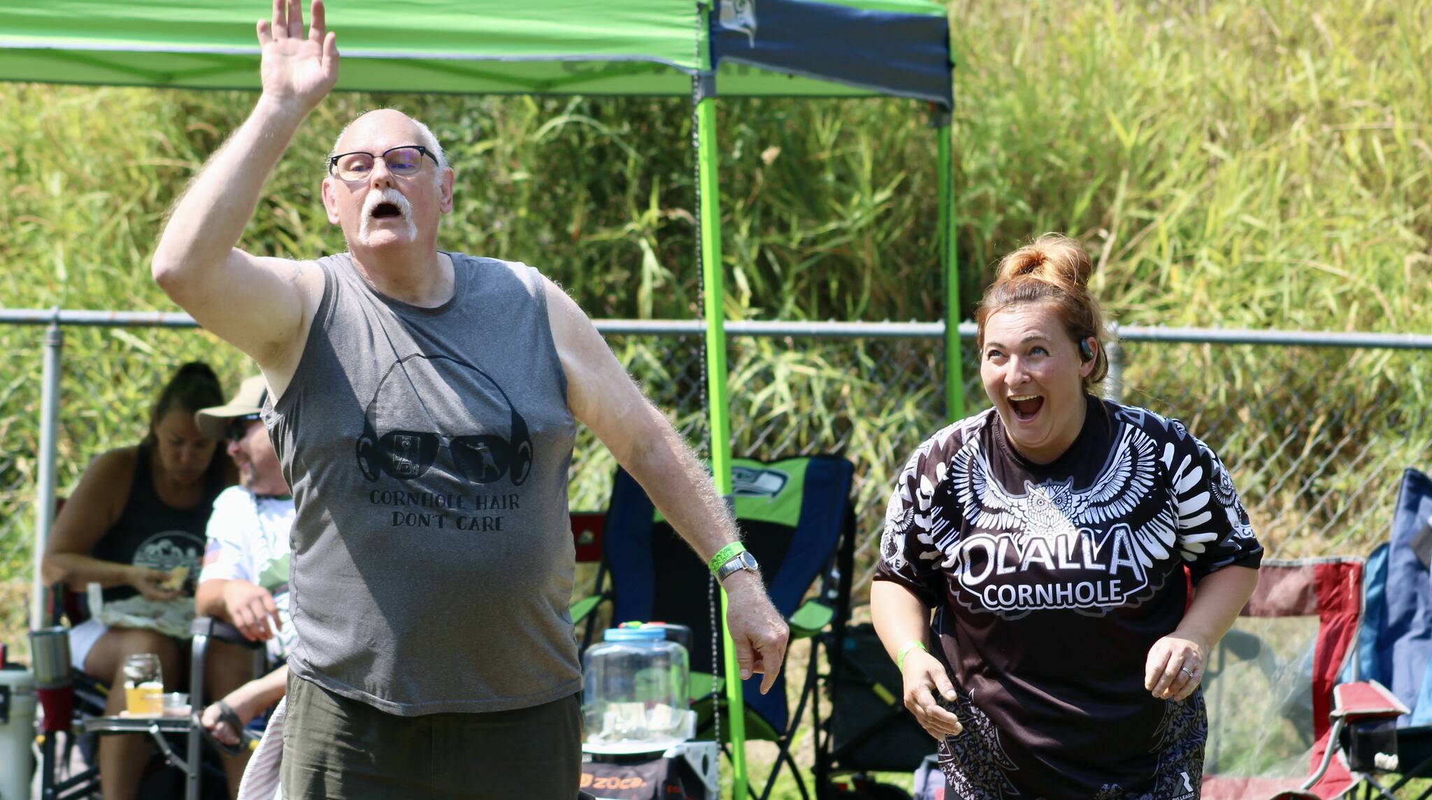 Elisha Meyer/Kitsap News Group photos
Kirk Altergott, left, makes his last throw in a game of cornhole, while Kaitie Anderson takes in her throw just a second before with a look of pleasant shock.