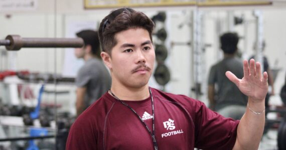 Elisha Meyer/Kitsap News Group
Kingston football coach Ethan Goldizen takes a few of his players through some off-season work in the weight room.