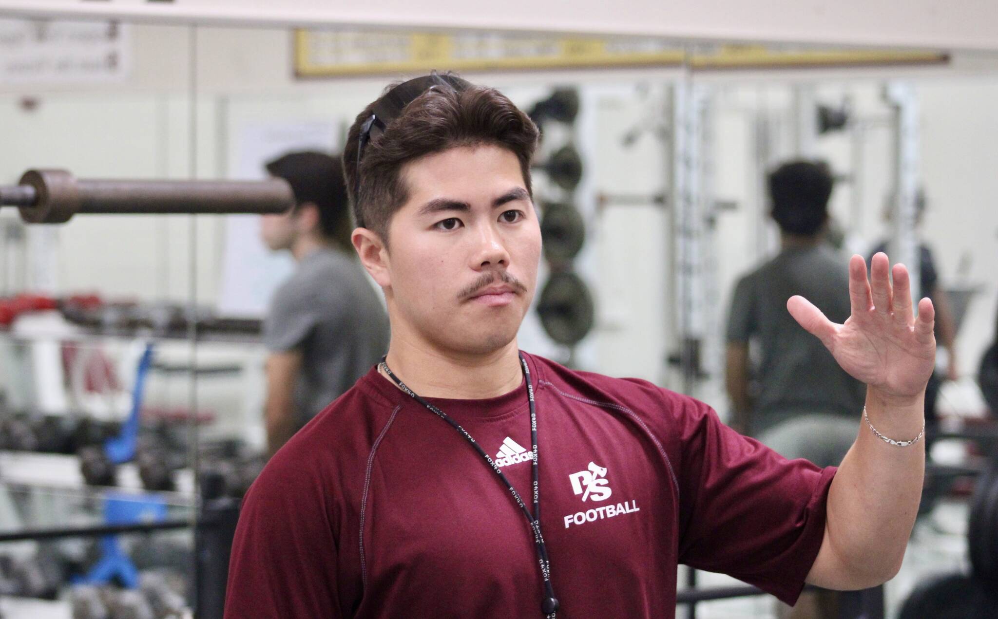 Elisha Meyer/Kitsap News Group
Kingston football coach Ethan Goldizen takes a few of his players through some off-season work in the weight room.