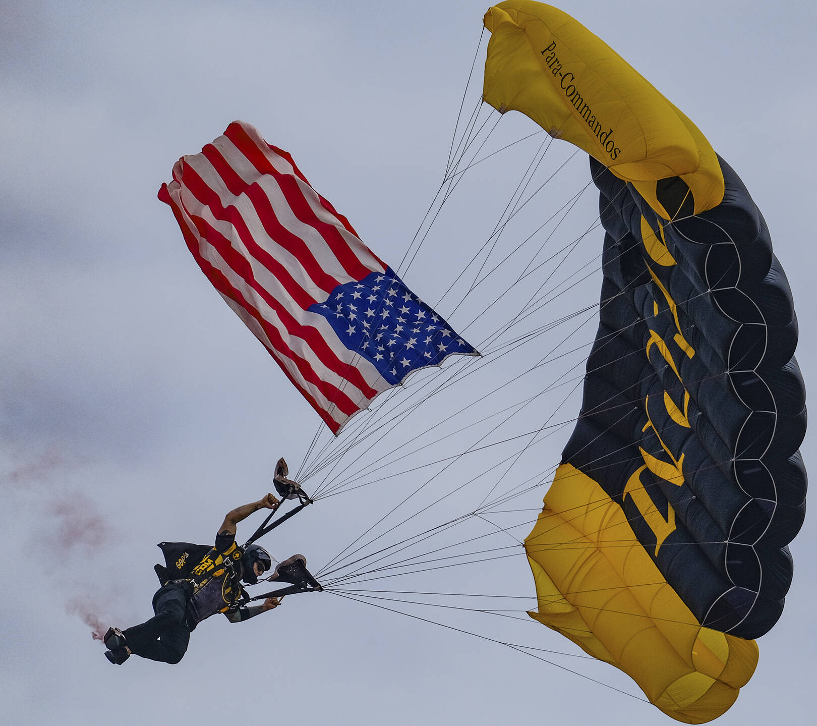 Damon Williams/Kitsap News Group photos
A U.S. flag flown in via parachute kicks off the airshow at the Bremerton Airport Aug. 17.