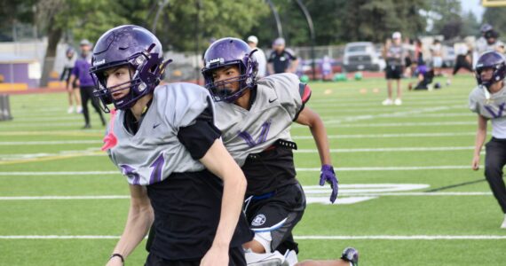 Elisha Meyer/Kitsap News Group photo
Viking players dash down the field for a special teams coverage drill at North Kitsap High School.