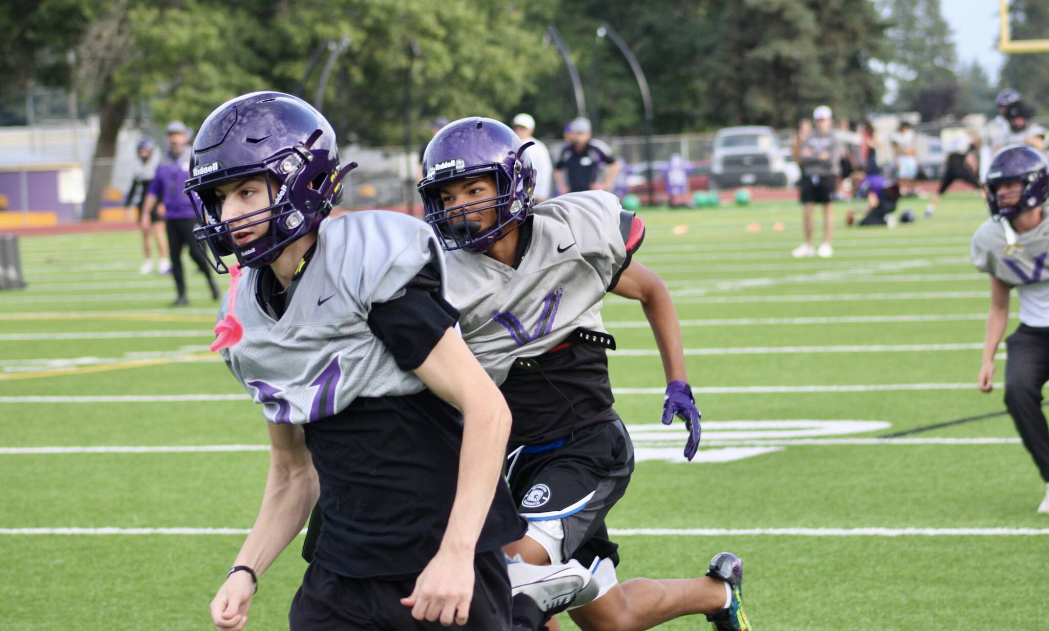 Elisha Meyer/Kitsap News Group photo
Viking players dash down the field for a special teams coverage drill at North Kitsap High School.