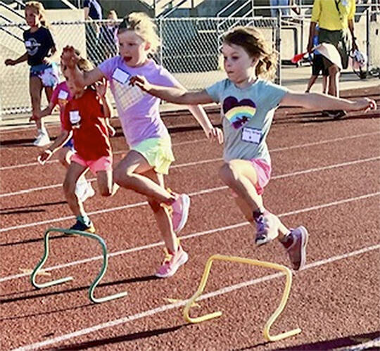 BI Kiwanis courtesy photos
Young girls jump over small hurdles in one of the events.