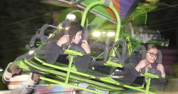 Damon Williams/Kitsap News Group photos
It can be a little bit of a blur on the rides at night at the Kitsap Fair. On this night crowds were small as the weather wasn’t the best.