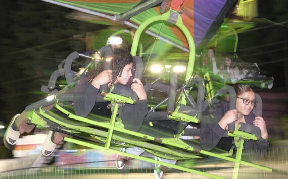 Damon Williams/Kitsap News Group photos
It can be a little bit of a blur on the rides at night at the Kitsap Fair. On this night crowds were small as the weather wasn’t the best.