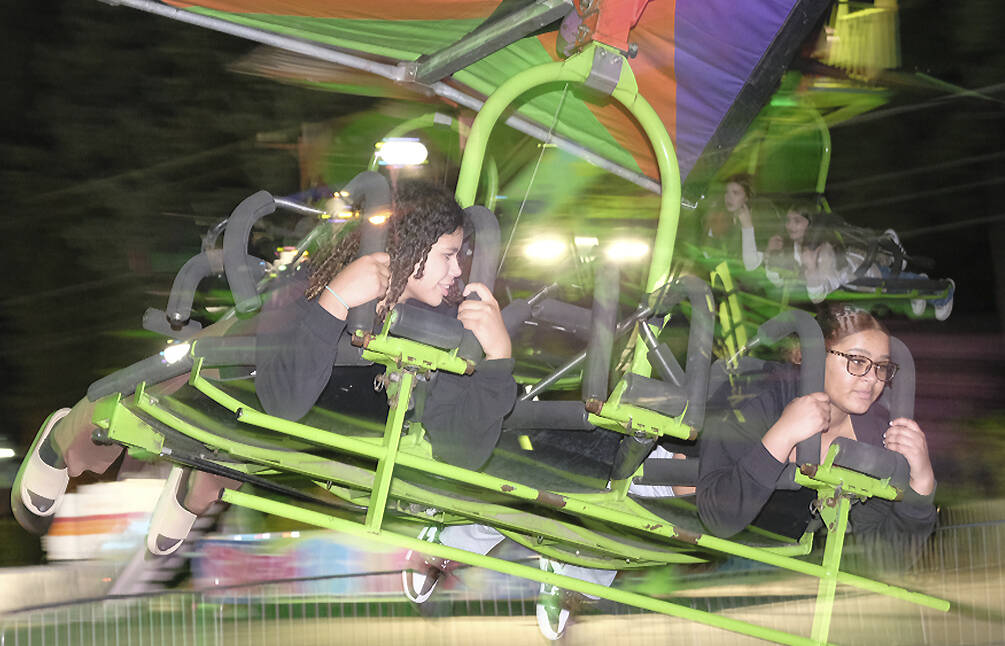 Damon Williams/Kitsap News Group photos
It can be a little bit of a blur on the rides at night at the Kitsap Fair. On this night crowds were small as the weather wasn’t the best.