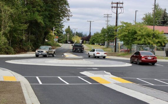 Elisha Meyer/Kitsap News Group
Drivers work their way through the new roundabout at the intersection of Mitchell Road and Lincoln Avenue.