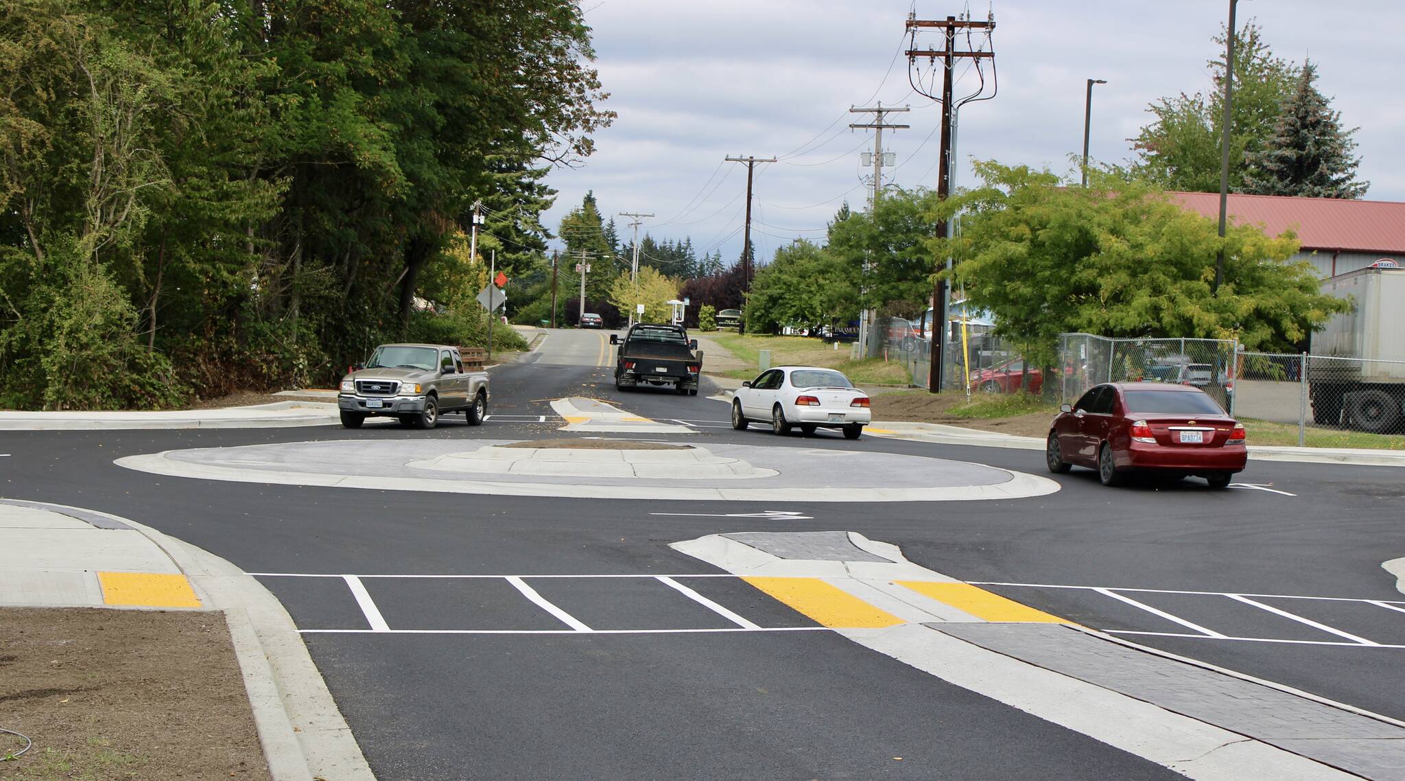 Elisha Meyer/Kitsap News Group
Drivers work their way through the new roundabout at the intersection of Mitchell Road and Lincoln Avenue.