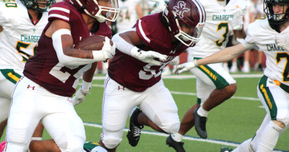 Elisha Meyer/Kitsap News Group photos
Senior running back Brycen Clay takes off on his first of many explosive runs on a four-touchdown day.