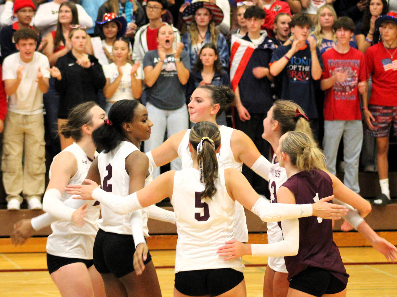 Elisha Meyer/Kitsap News Group
The South Kitsap players and student section celebrate a point in the third set against the North Kitsap Vikings.