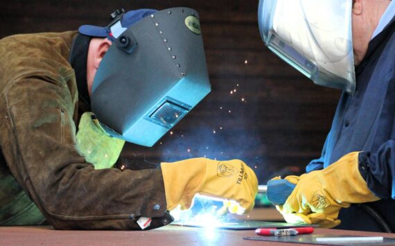 Elisha Meyer/Kitsap News Group photos
Al Kitchens, left, takes Olympic College President Marty Cavalluzzi through a ceremonial first weld in the new Shops Building.