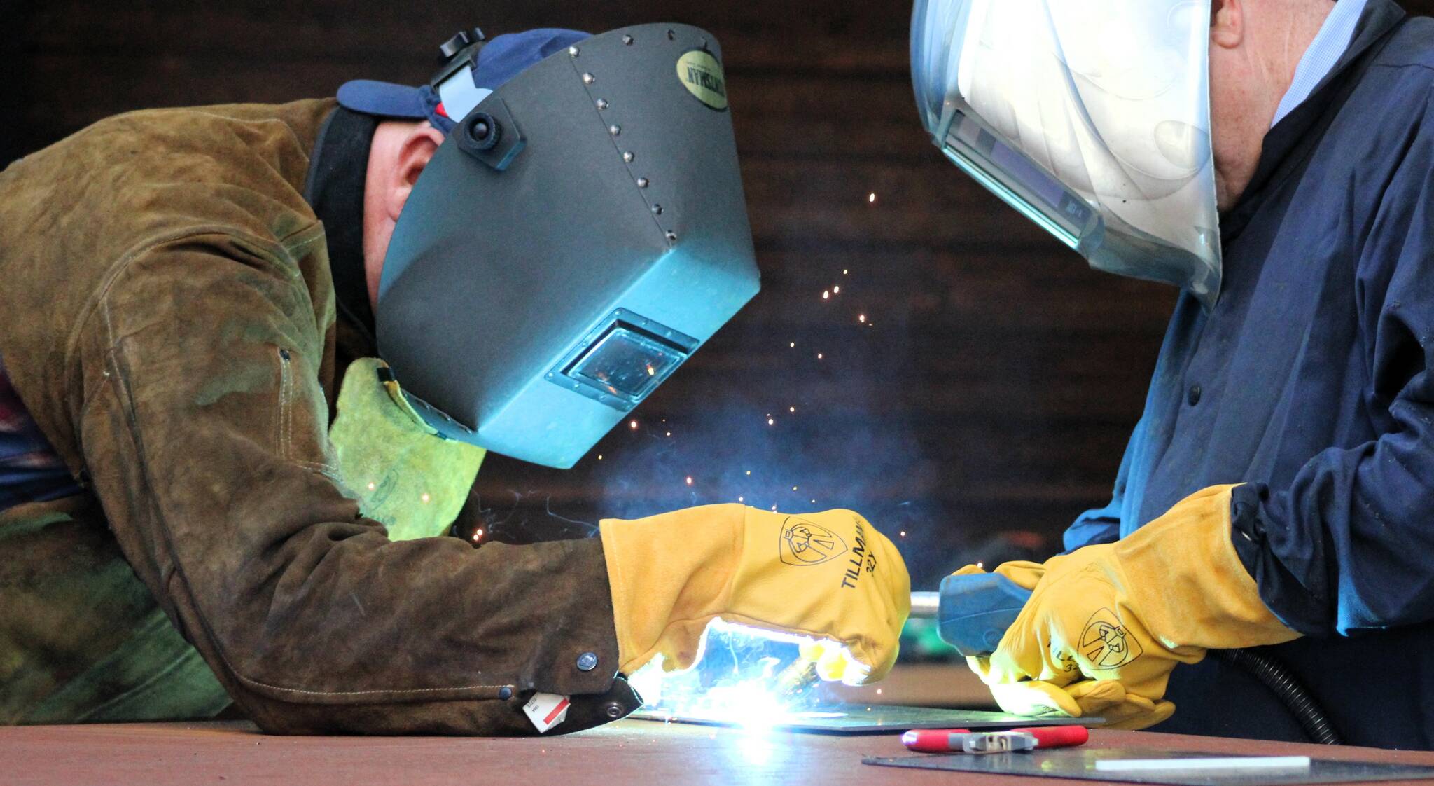 Elisha Meyer/Kitsap News Group photos
Al Kitchens, left, takes Olympic College President Marty Cavalluzzi through a ceremonial first weld in the new Shops Building.