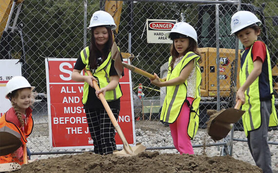 NKSD courtesy photos 
Wolfle Elementary students dig their shovels into the dirt to signify the groundbreaking of the school’s new gym project, expected to open in spring of 2025.