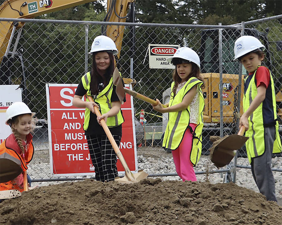 NKSD courtesy photos 
Wolfle Elementary students dig their shovels into the dirt to signify the groundbreaking of the school’s new gym project, expected to open in spring of 2025.