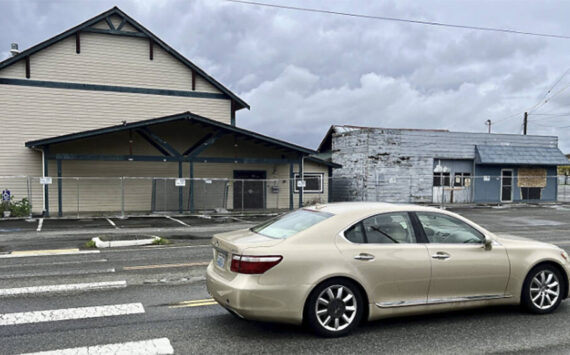 Britney Fletcher West/Kitsap News Group
A car drives by some of the buildings that will come down.