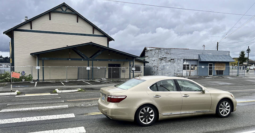 Britney Fletcher West/Kitsap News Group
A car drives by some of the buildings that will come down.