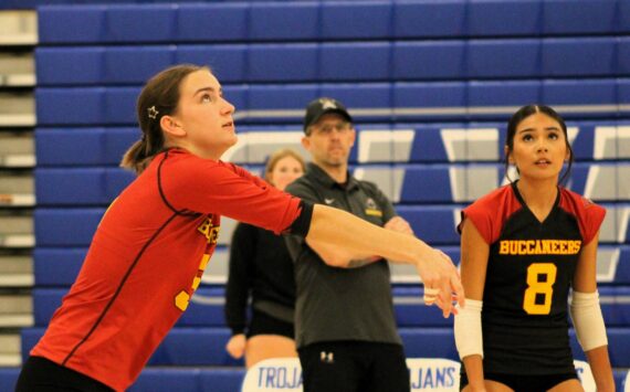 Elisha Meyer/Kitsap News Group photos
Buc senior Corynn Heuer, left, gets the serve up in a match at Olympic High School.