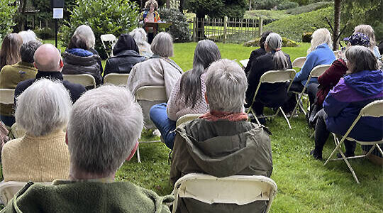 Bloedel courtesy photo 
Bainbridge Island poet laureate Michele Bombardier welcomes guests to a poetry reading at the Bloedel Reserve honoring renowned poet Theodore Roethke, who died there in 1963.