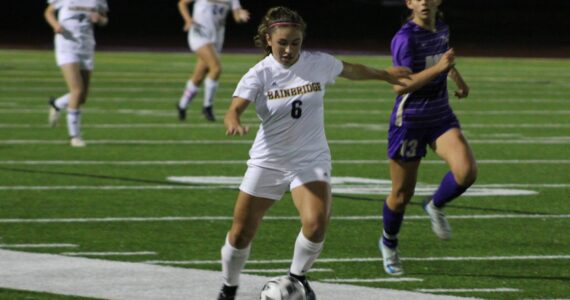 Elisha Meyer/Kitsap News Group
Bainbridge senior Sophia Weindi shoots a pass downfield in overtime against the Vikings.