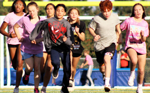 Elisha Meyer/Kitsap News Group photos
Track athletes sprint down the new football/soccer field at Mountain View Middle School in Bremerton.