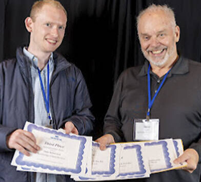 WNPA courtesy photo
Tyler Shuey and Steve Powell pick up the awards won by Bainbridge Island Review staff.