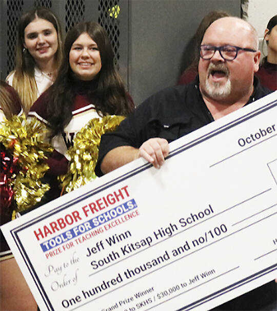 Harbor Freight courtesy photo
South Kitsap High School trades teacher Jeff Winn celebrates receiving a check for $100,000 for himself and his school program Oct. 8.