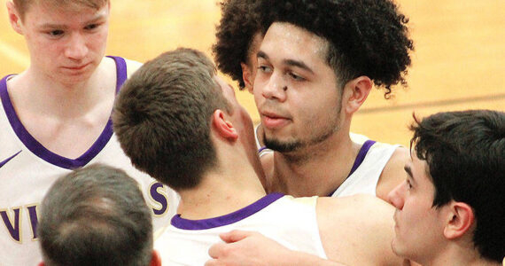 File photo
Shaa Humphrey is congratulated by teammates after reaching the 1,000-point milestone for North Kitsap as a senior. He is now the Vikings head coach.