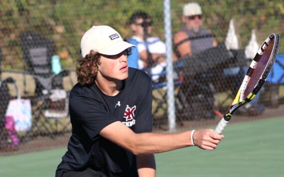 Elisha Meyer/Kitsap News Group photos
SK senior Sam Colson goes low to get his racket on the ball.