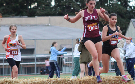 Elisha Meyer/Kitsap News Group photos
Runners in all races at the Hawk’s Nest Invitational came across the occasional hurdle of hay, a fun part of the speedy 3,000-meter course.