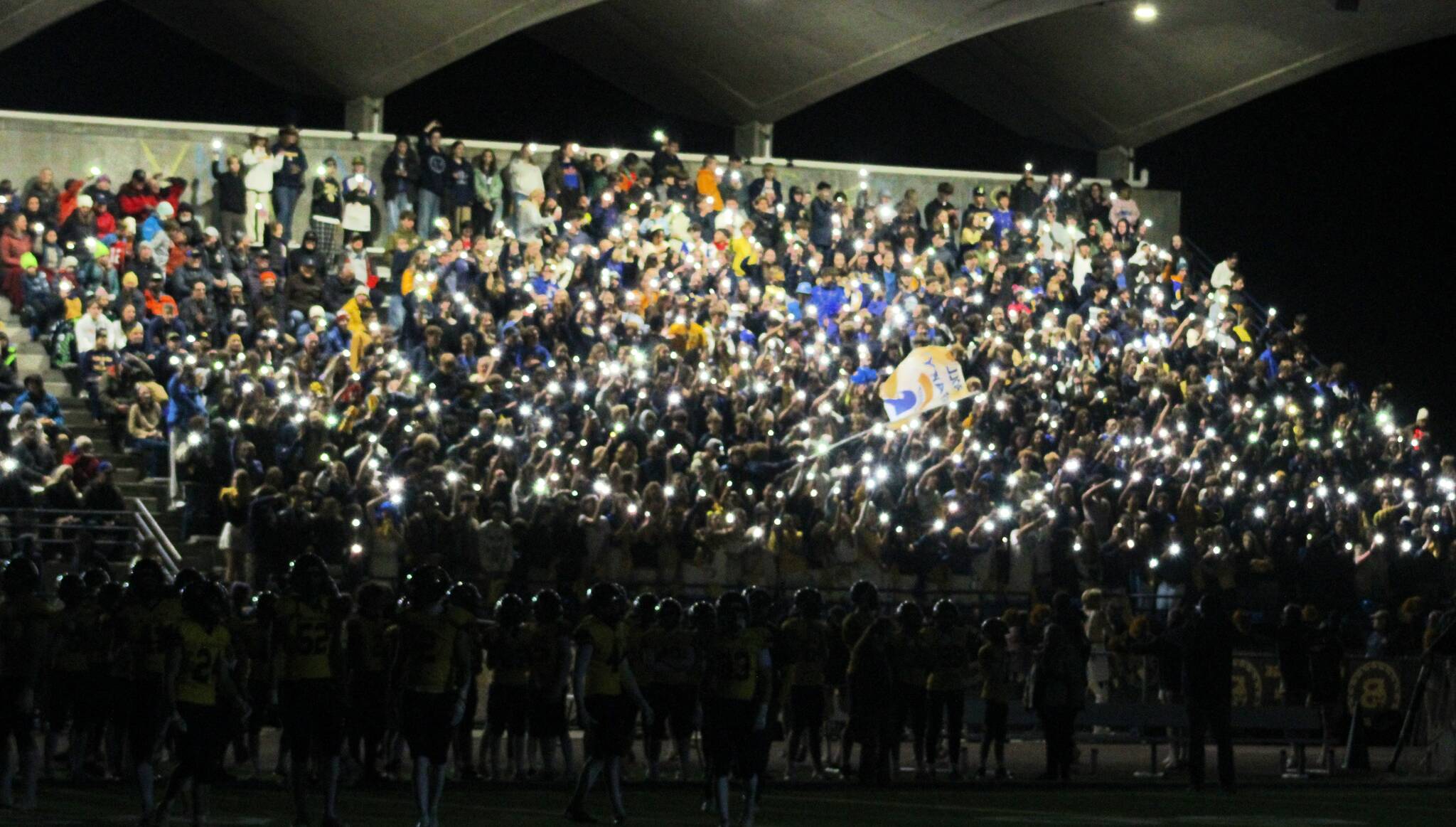 Elisha Meyer/Kitsap News Group photos
The Bainbridge High School student section helps illuminate the night in the first of two light outage delays in an Oct. 18 gave vs. North Kitsap.