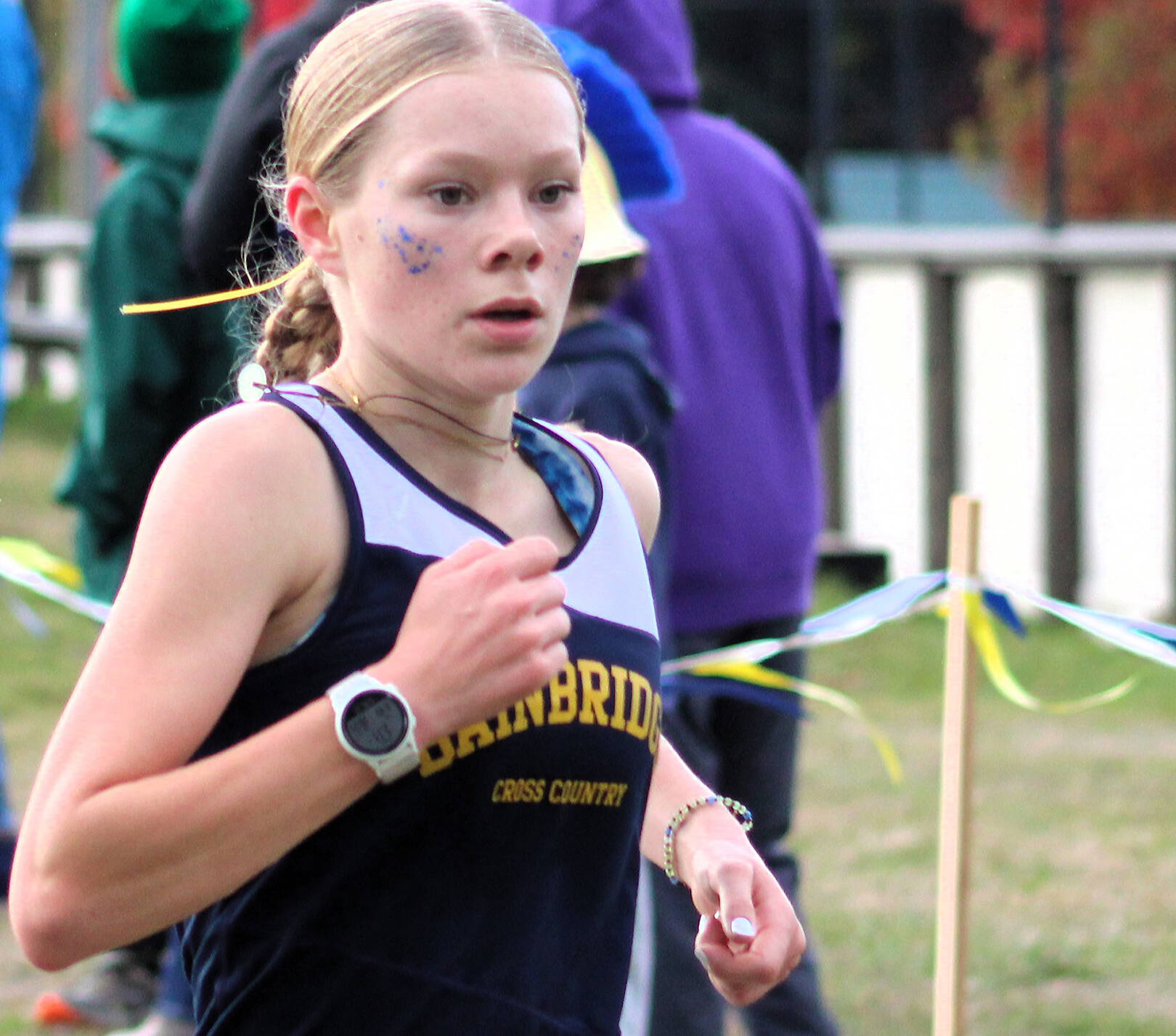 Elisha Meyer/Kitsap News Group
Junior Savai Esarey crosses the finish line at her team’s home course at Battle Point Park on Bainbridge Island Oct. 18.