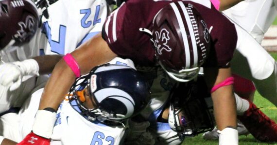 Elisha Meyer/Kitsap News Group photos
SK senior Josaiah Asuega takes down a Rogers ball carrier in the first half of an Oct. 25 game.