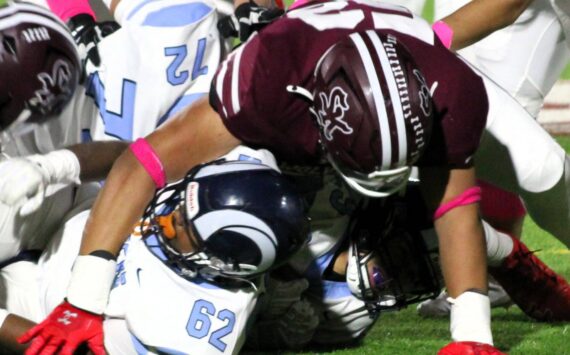 Elisha Meyer/Kitsap News Group photos
SK senior Josaiah Asuega takes down a Rogers ball carrier in the first half of an Oct. 25 game.