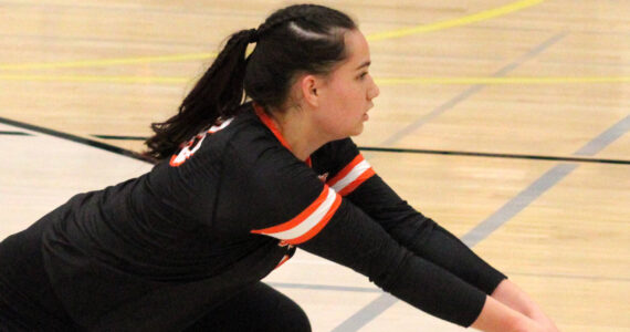 Elisha Meyer/Kitsap News Group photos
CK sophomore Manaia Pasi digs a Lincoln spike to keep the point alive.