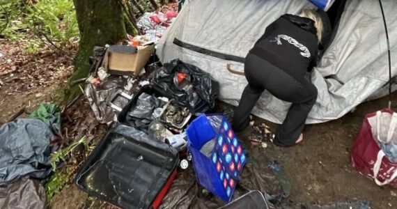 Britney Fletcher-West/Kitsap News Group
A HEART team member clearing out an encampment in Kitsap County.