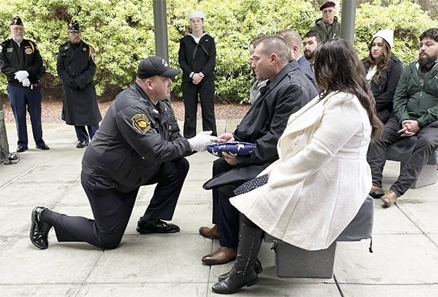 Bergeron family courtesy photos
Bill Bergeron Jr. receives a U.S. flag at a military funeral for his father.