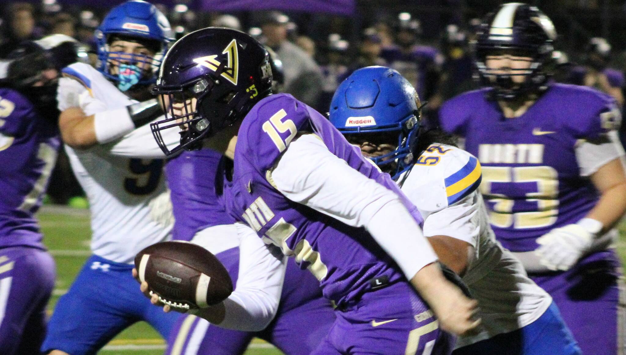 Elisha Meyer/Kitsap News Group photos
NK junior quarterback Dawsyn Anderson takes the ball toward the sideline in a first-half scramble away from Bremerton pressure.