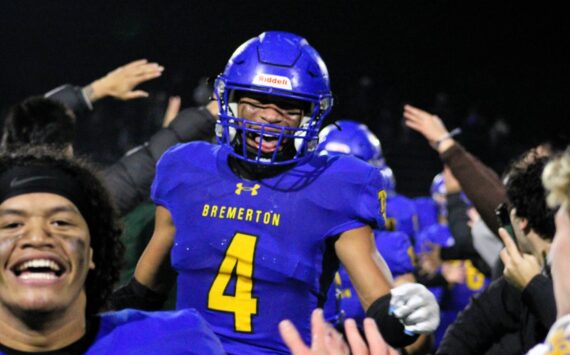 Elisha Meyer/Kitsap News Group photos
Junior Marquise Allen (No. 4) sprints into a crowd of teammates and Bremerton students to celebrate the Knights’ walk-off touchdown Nov. 5