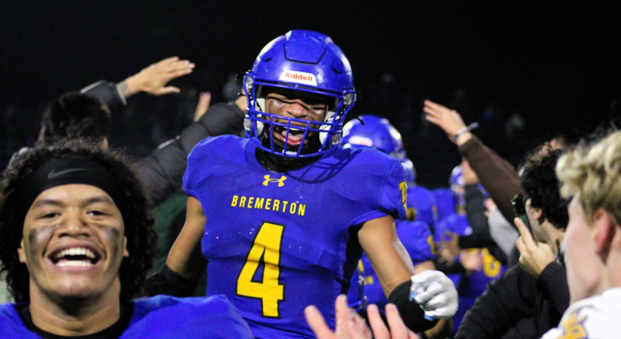 Elisha Meyer/Kitsap News Group photos
Junior Marquise Allen (No. 4) sprints into a crowd of teammates and Bremerton students to celebrate the Knights’ walk-off touchdown Nov. 5