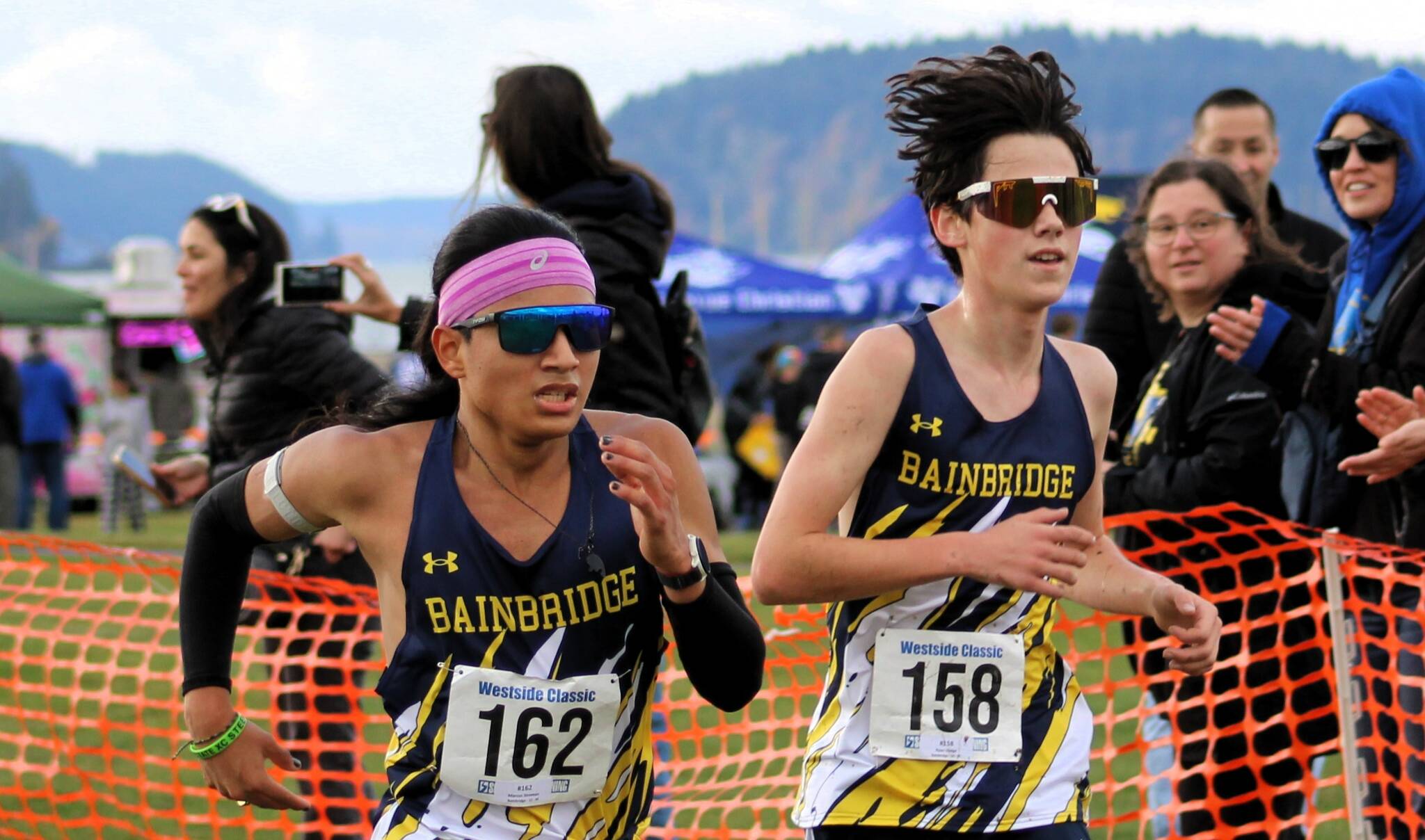 Elisha Meyer/Kitsap News Group photos
Bainbridge senior Marcus Stroman, left, makes a pass around sophomore teammate Ryan Dodge in the final sprint of districts Nov. 2.