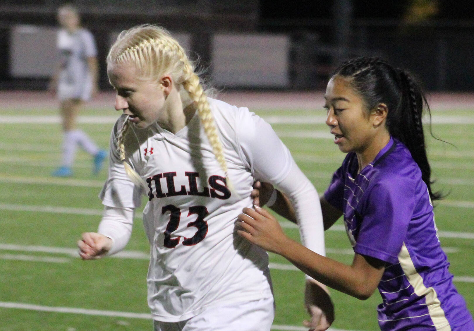 Elisha Meyer/Kitsap News Group
North Kitsap junior Addy Jueco tries to get the ball from a Lumberjills player in the first half of the Vikings’ state opener.